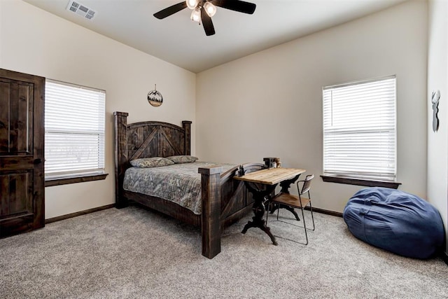 carpeted bedroom with ceiling fan and lofted ceiling