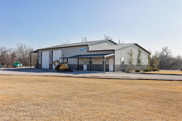 exterior space featuring covered porch and a garage