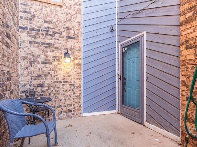 entrance to property with a patio area