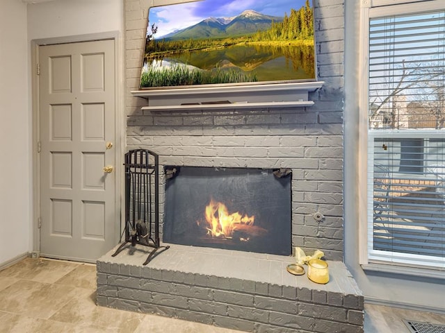 room details featuring a brick fireplace