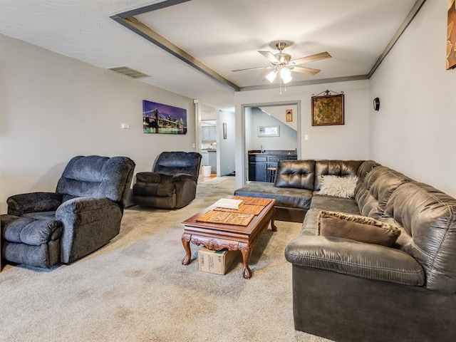 living room with carpet floors and ceiling fan