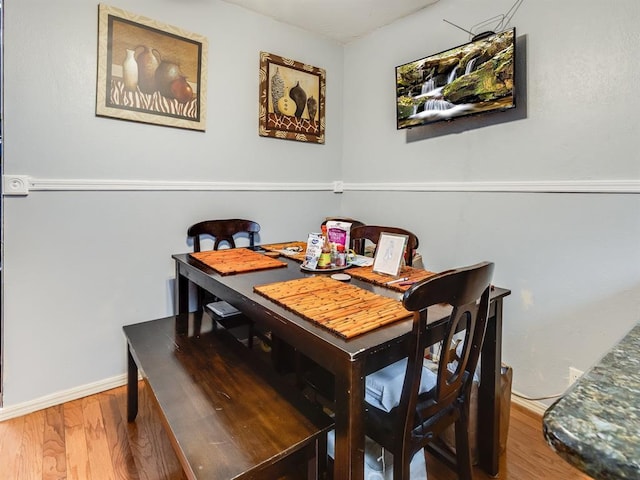 dining area with hardwood / wood-style floors