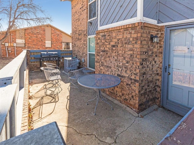 view of patio / terrace with central AC unit and area for grilling