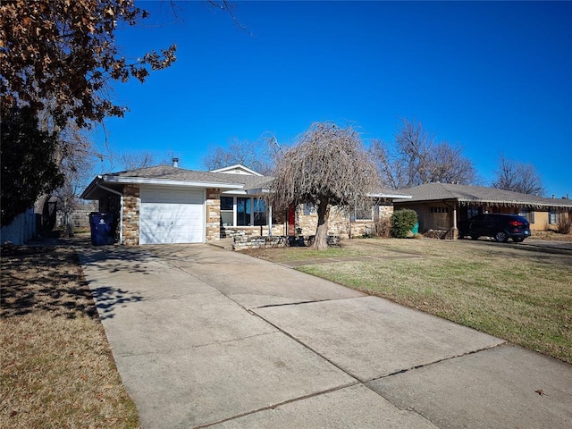 ranch-style house featuring a carport, a garage, and a front yard