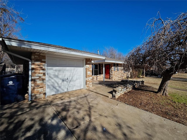 ranch-style home featuring a garage