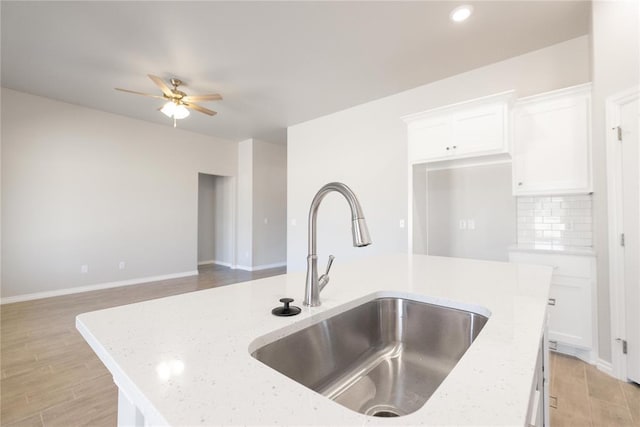 1917 Taines Turn, Norman, OK 73072 - kitchen featuring a sink, ceiling fan, light wood-type flooring, and white cabinetry