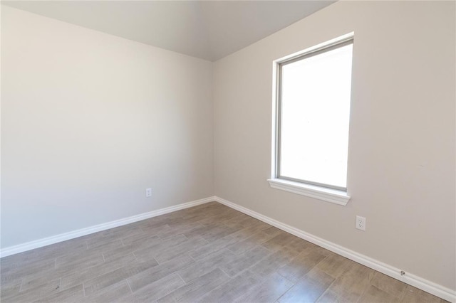 1917 Taines Turn, Norman, OK 73072 - spare room featuring baseboards and light wood-style floors