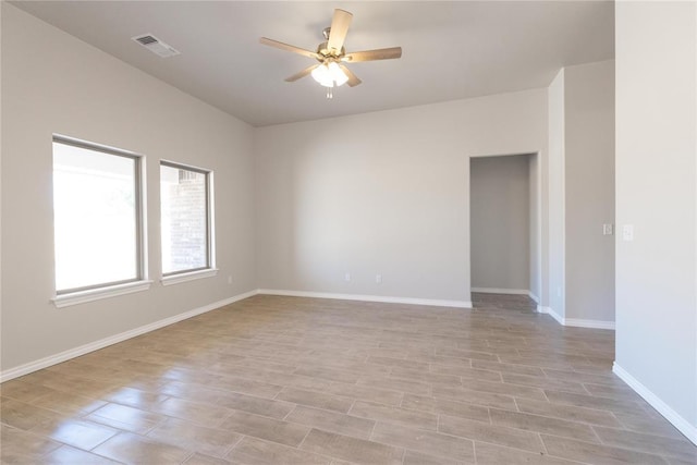 1917 Taines Turn, Norman, OK 73072 - unfurnished room with baseboards, ceiling fan, light wood finished floors, and visible vents