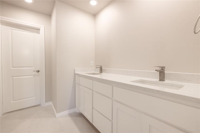 1917 Taines Turn, Norman, OK 73072 - full bathroom with recessed lighting, a sink, baseboards, and double vanity