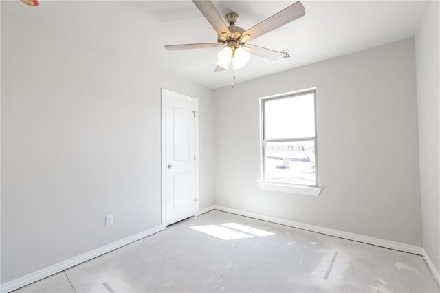1917 Taines Turn, Norman, OK 73072 - spare room with baseboards, a ceiling fan, and concrete flooring