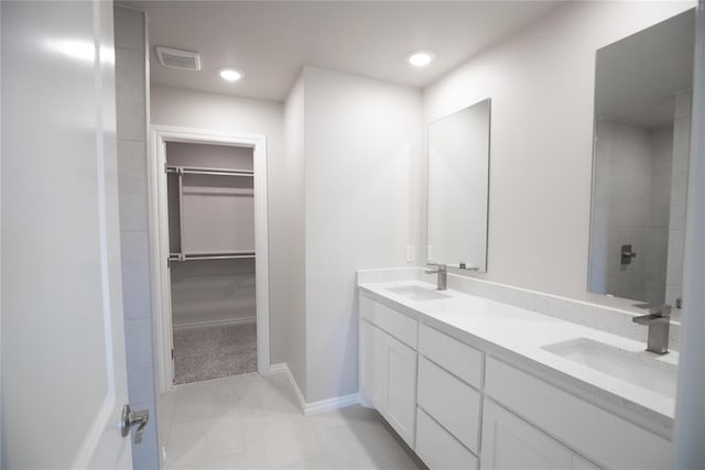 1917 Taines Turn, Norman, OK 73072 - full bath featuring double vanity, a walk in closet, recessed lighting, and tile patterned floors