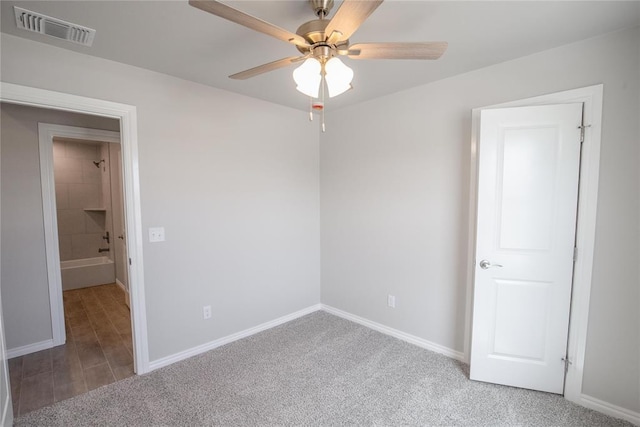 1917 Taines Turn, Norman, OK 73072 - empty room with a ceiling fan and carpet floors