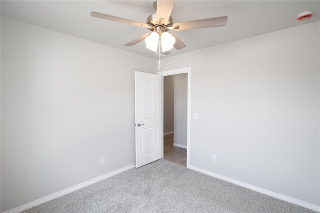 1917 Taines Turn, Norman, OK 73072 - carpeted empty room featuring ceiling fan and a smoke detector