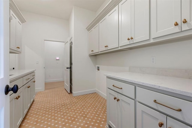 washroom featuring cabinets and hookup for a washing machine