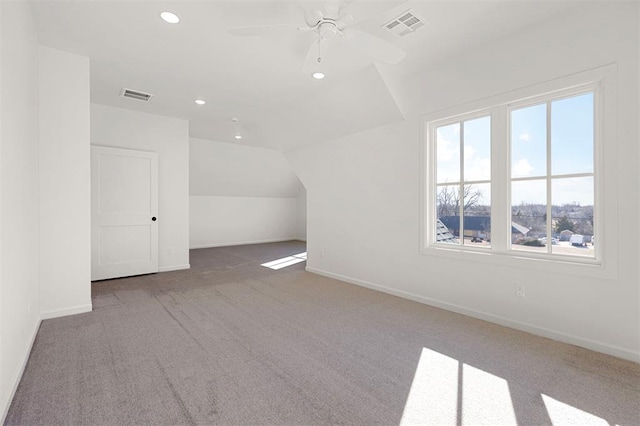 bonus room featuring ceiling fan, carpet, and vaulted ceiling