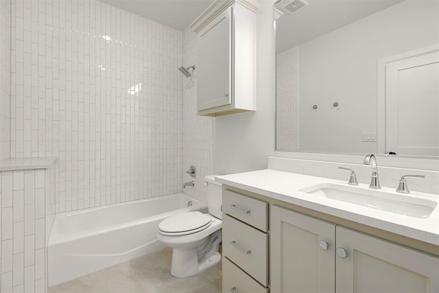 full bathroom with tile patterned floors, toilet, vanity, and tiled shower / bath