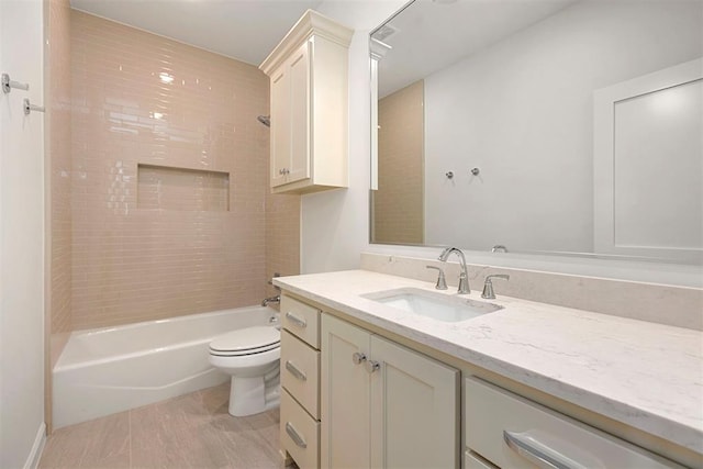 full bathroom featuring vanity, toilet, and tiled shower / bath