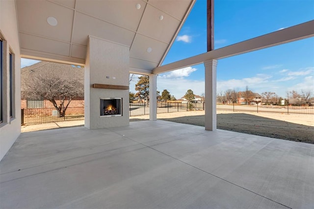 view of patio with a fireplace