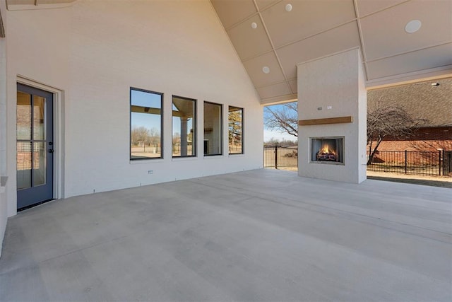 view of patio with a large fireplace