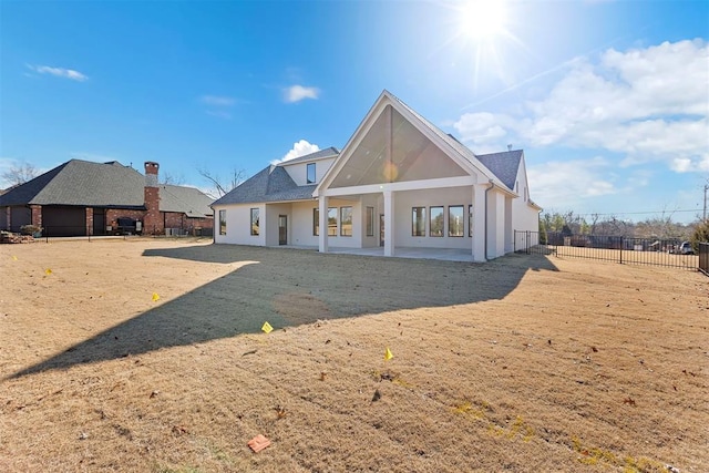 rear view of property featuring a patio area