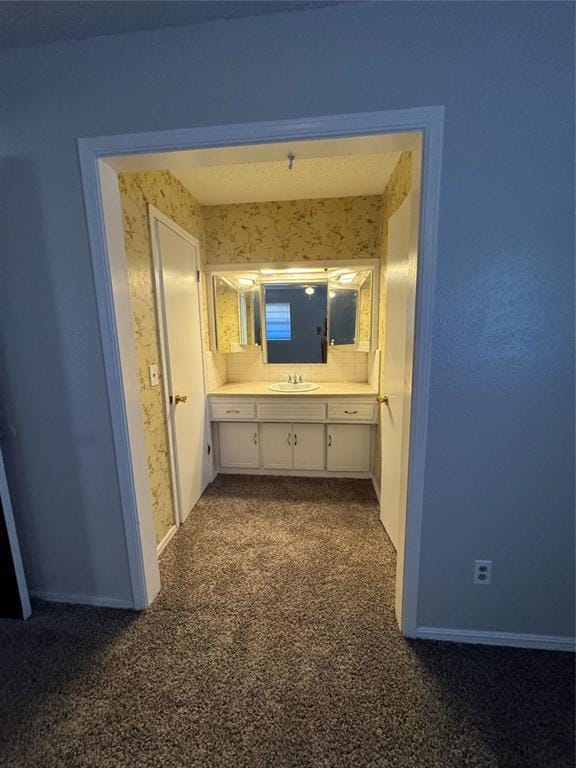 bathroom with backsplash and vanity