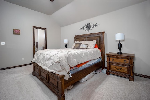 bedroom featuring light carpet and vaulted ceiling