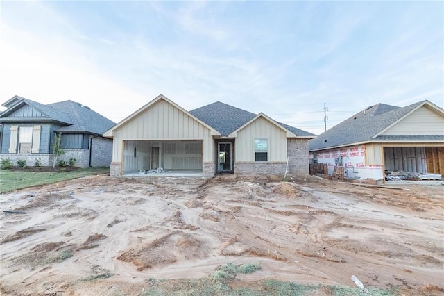 view of front of home featuring board and batten siding and a garage