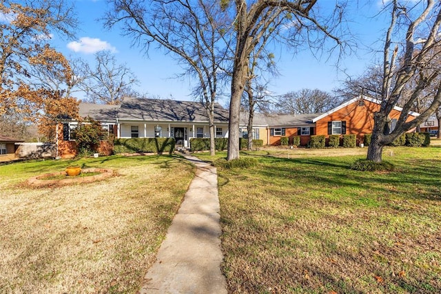 ranch-style home featuring a front yard