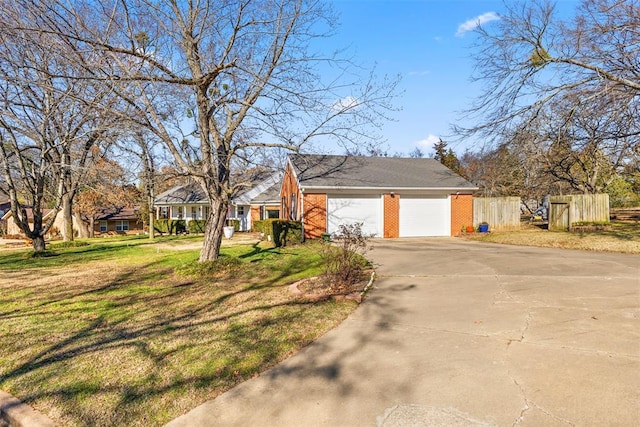 view of side of property with a yard and a garage