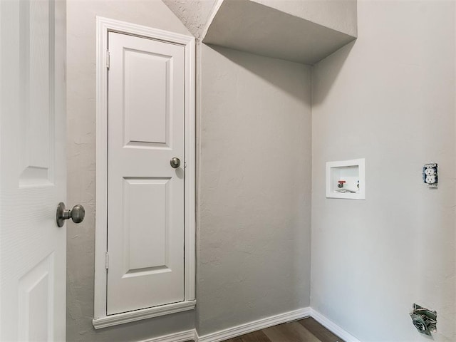 laundry area featuring washer hookup and dark hardwood / wood-style floors