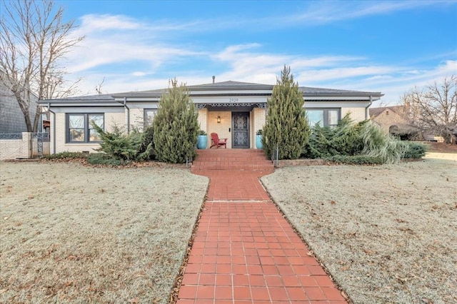 view of front of home with brick siding