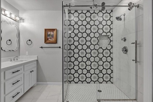 full bath with a shower stall, baseboards, and vanity