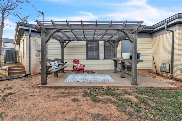 exterior space featuring central AC unit and a pergola