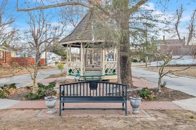 exterior space featuring fence and a gazebo