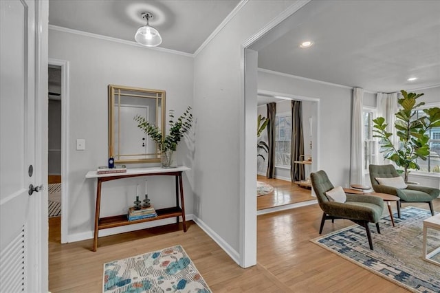 entryway with recessed lighting, crown molding, baseboards, and wood finished floors