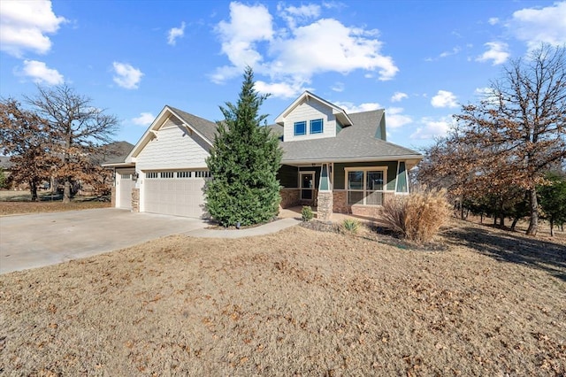 view of front of house with a porch and a garage