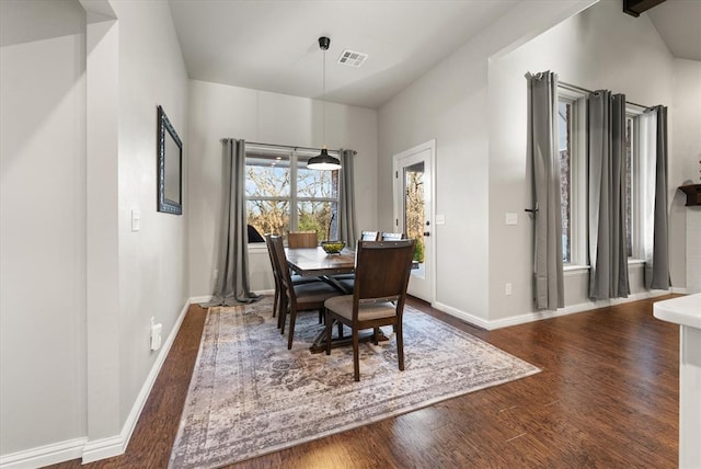 dining room with dark hardwood / wood-style flooring