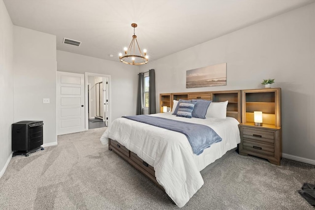 bedroom with carpet flooring and an inviting chandelier