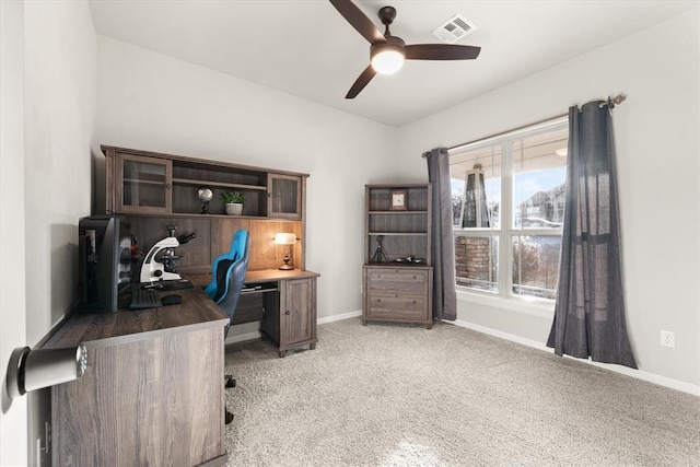 office area featuring light colored carpet and ceiling fan