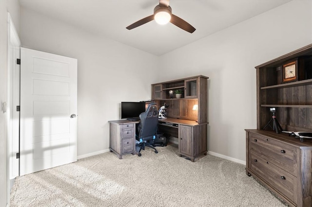 carpeted office featuring ceiling fan