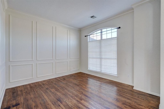 unfurnished room featuring dark hardwood / wood-style flooring and ornamental molding