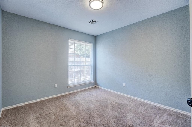 unfurnished room with carpet flooring