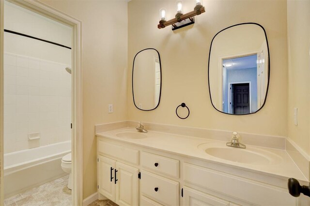 full bathroom featuring vanity,  shower combination, and toilet