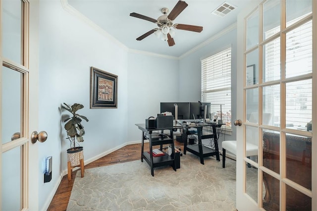 home office featuring ceiling fan, crown molding, french doors, and light wood-type flooring