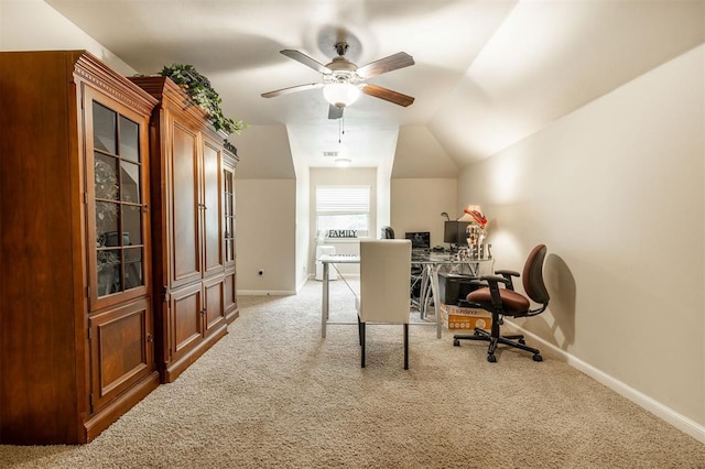 carpeted home office featuring ceiling fan and lofted ceiling