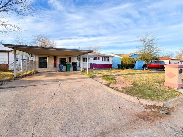 view of front of property with a carport