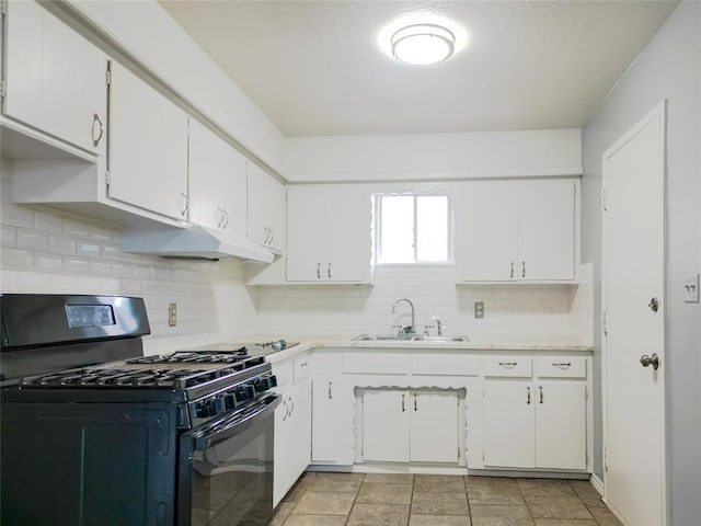 kitchen featuring light countertops, black range with gas stovetop, a sink, and under cabinet range hood