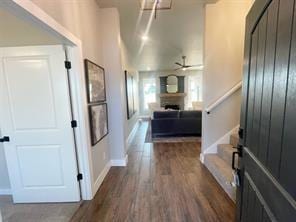 corridor featuring dark hardwood / wood-style flooring