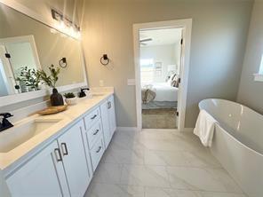 bathroom featuring vanity and a bathtub