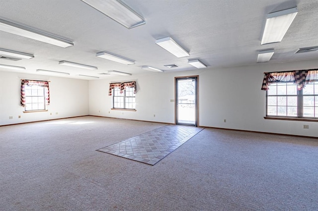 unfurnished room with carpet flooring